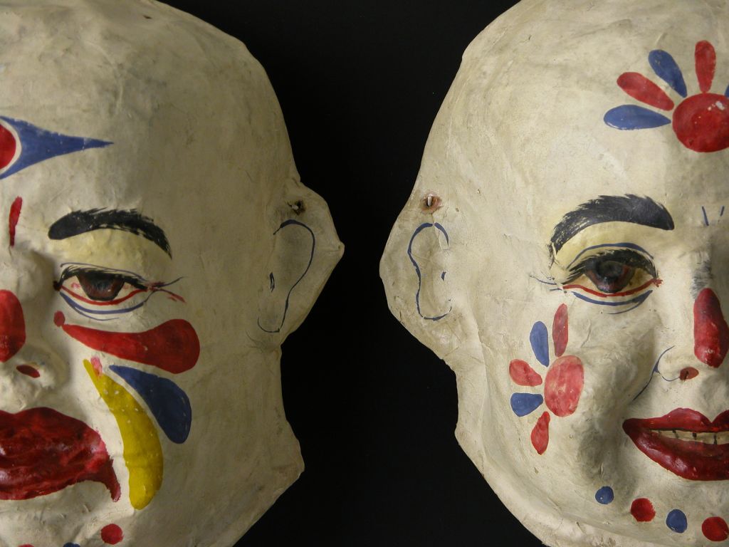 Custom mounted paper mache masks painted in polychrome. Manufactued by The American Mask Maufacturing Company, Finday, Ohio.