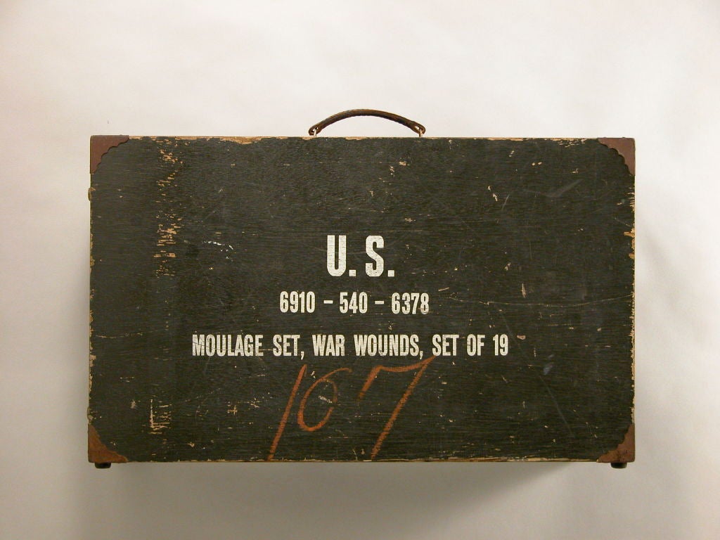 US Military issue battlefield-training kit. A suit cased set of nineteen latex prosthetic wounds. Complete with original packets of powdered blood and pumps to add realism. <br />
<br />
The case measures 25 inches when closed.