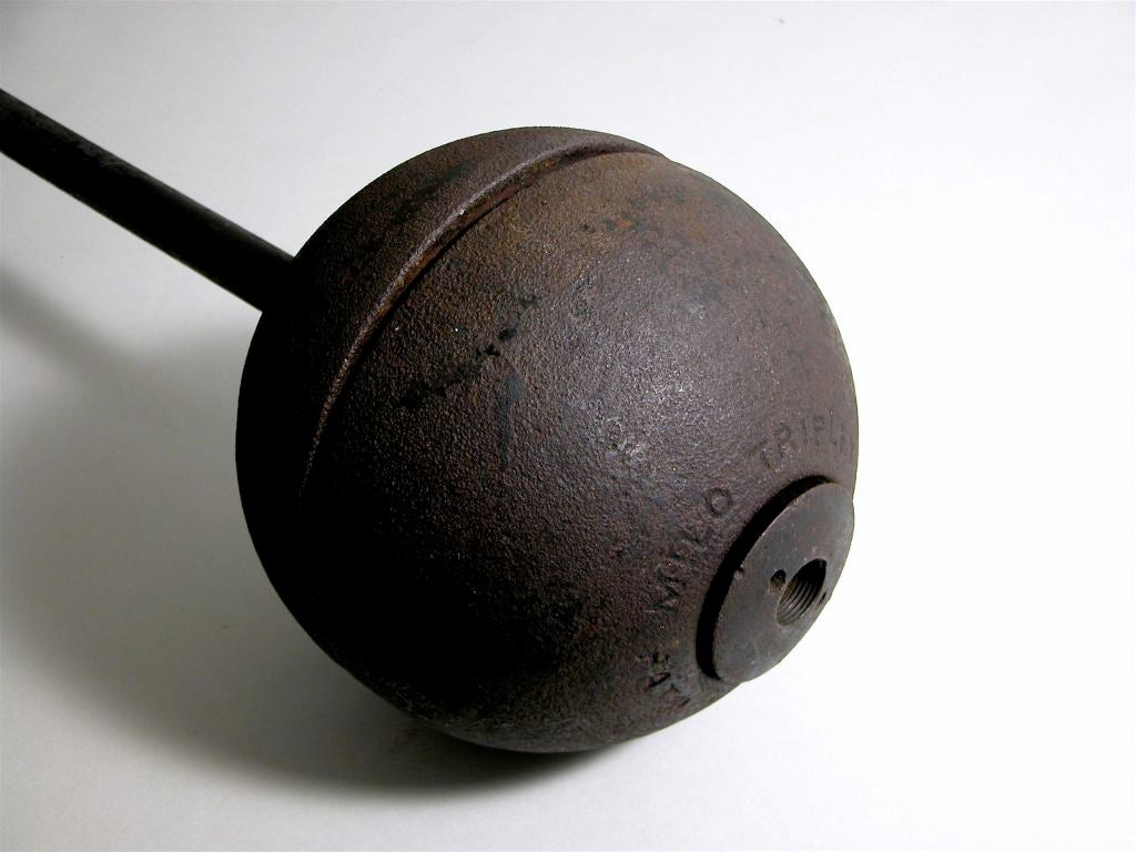Forged iron bar, cast iron spherical ends cast for function in a hollow two-part construction.

Hemispheric hollow ends remove revealing weight slices within which can be individually adjusted for different lifting preferences