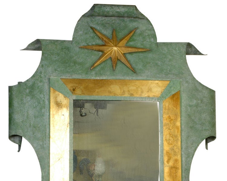 This mirror after the original designed by Gilbert Poillerat (1902-1988) and Andre Arbus (1903-1969) measures an impressive 58 by 38 inches (147 by 96 cm). Mirrored glass measures roughly 24 by 16 inches (61 by 41 cm). This mirror is believed to be