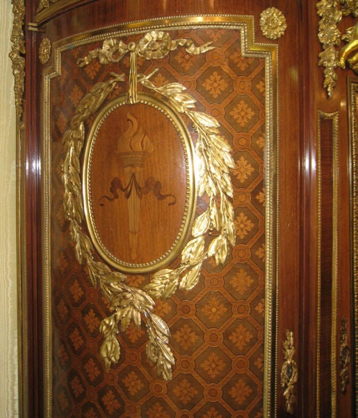 This extraordinary, palace-size French Empire Revival armoire dates from circa 1900 and measures 98