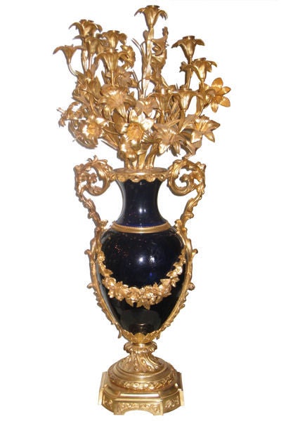 This pair of monumental cobalt blue porcelain urn form candelabra in the French Louis XV style, circa 1880s, measure 43