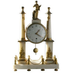 A French Louise XVI White Marble Mantle Clock