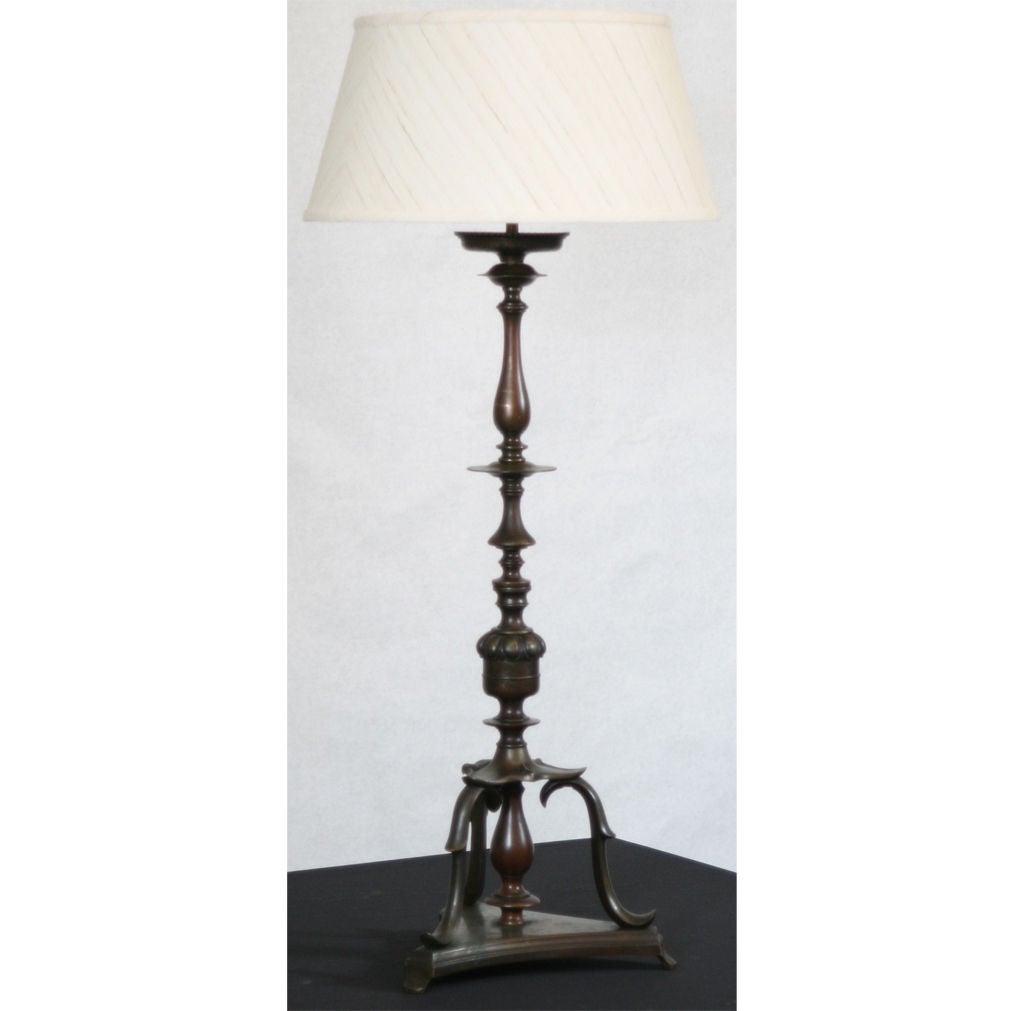 Stunning brass table lamp with great turnings and stylish lamp.  The lamp through the years has gained a truly magnificent patina. shade not included.
