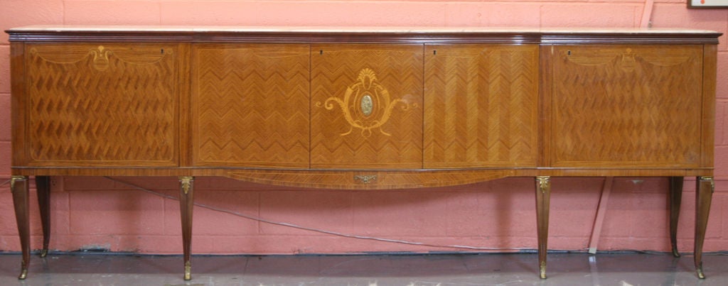 Large Marquetry Sideboard by Dassi, with 3 piece Beveled marble top.  Nicely cast Ormolu mounts, and sabots.