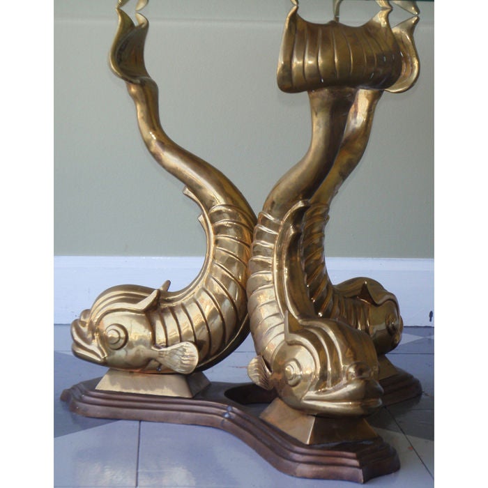 Great Bronze table base which supports a glass top with it's tail. A fun conversation piece which doubles as a functional piece of furniture.