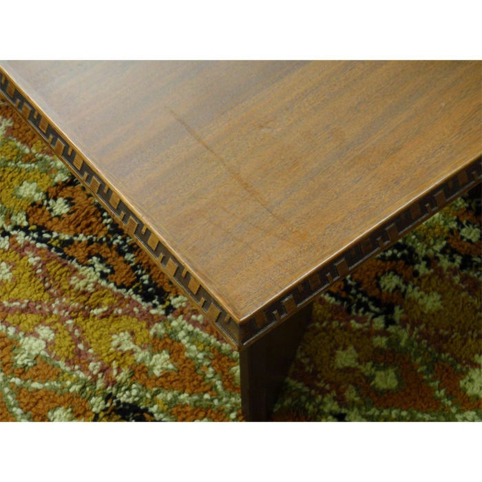 Dining Table designed by Frank Lloyd Wright for Heritage Henredon.  The table has 2 -18 inch leaves.  The table opens up to 100 inches long.  The table is signed underneath with his branding, and the manufacturers name.