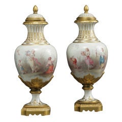 Pair of Meissen hand painted covered urns