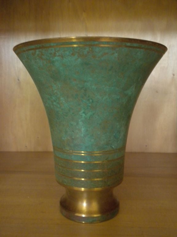 A bronze Vase (this is the medium size of the three in our current collection) hand tooled and finished to a verdigris patina by Carl Sorensen. Signed at the back of the Vase 