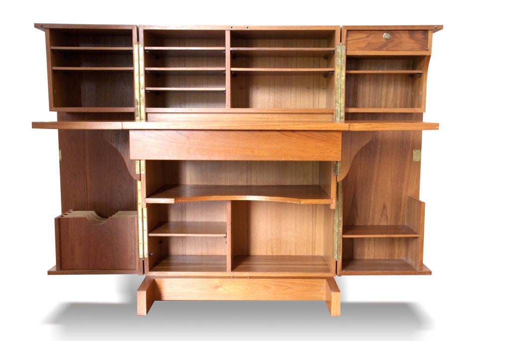 A fantastic secretary ingeniously designed for small and large spaces. It's accourtments alone are stunning! The entire cabinet closes to look like a simple armoire but when open is a full-fledged work space with a place for everything - lap top,