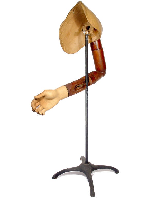 This is an odd Mannequin that was used to hand sew sleeves and cuffs. The shoulder and hand are paper mache and the arm is wood. Note that the arm has a number of adjustments for length and angle. It also has ball joints in the shoulder and elbow.