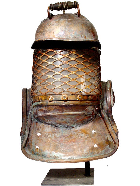 Over the years I've owned many diving helmets. The only examples that still hold my interest are pieces that were home made with character. This one is amazing and very tribal! It was built from scratch in copper and looks as if it's wearing a