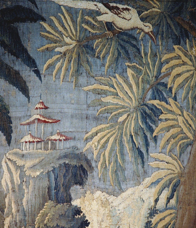 A very nice size tapestry with some reduction to the original dimensions. Landscape depicting birds, flowers and a structure on a mountain top.