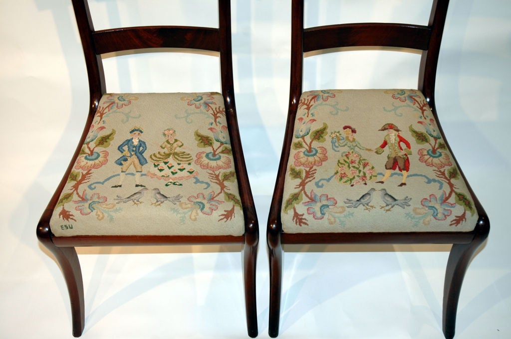 A pair of mahogany,Philadelphia region, empire<br />
sidechairs with exceptional needlepoint seats, each having classical figures in landscape.
