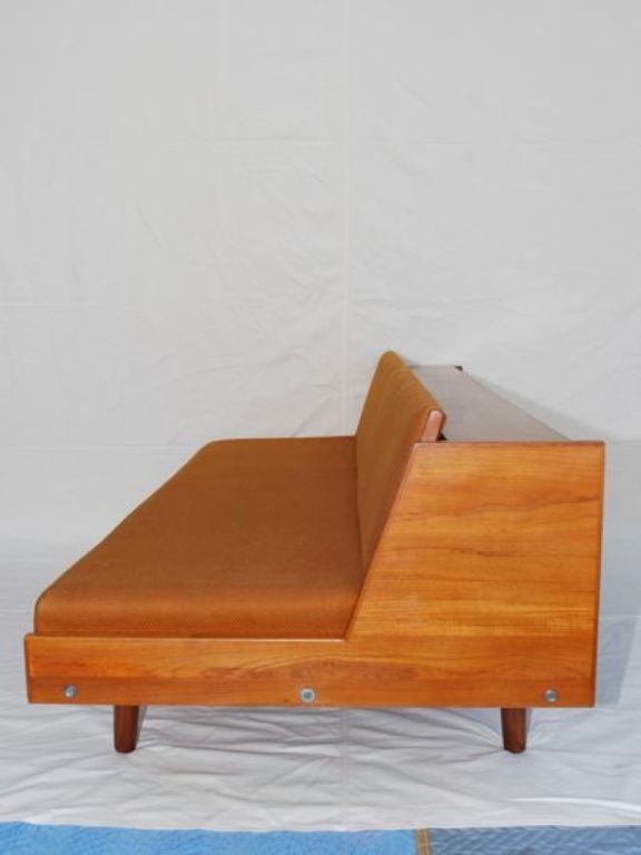 A beautiful 1950 ' s  Hans Wagner day bed,  the back can be lift up, and become a bed, ( see in picture # 3 ), perfect for mid century style, it has the stamp under the day bed