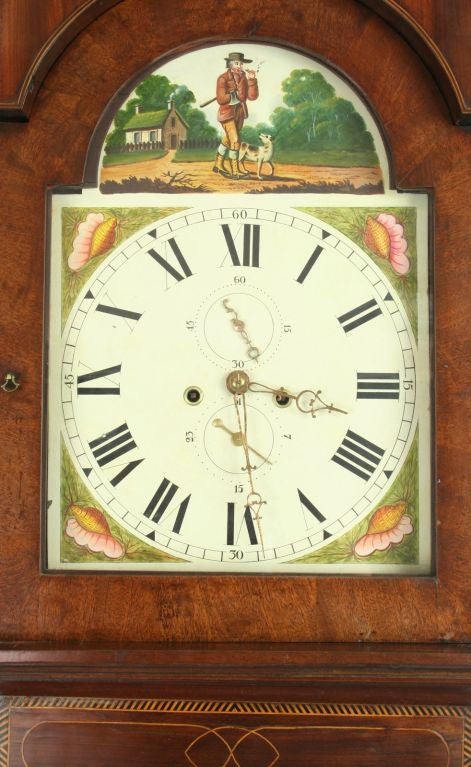 Item #: Y-9-0<br />
<br />
Antique Victorian Grandfather Clock Woodcutter Mahogany<br />
<br />
Comment: <br />
<br />
A fine English Tall Clock in a magnificent mahogany case. The bonnet is topped with a swan’s neck pediment ending in brass