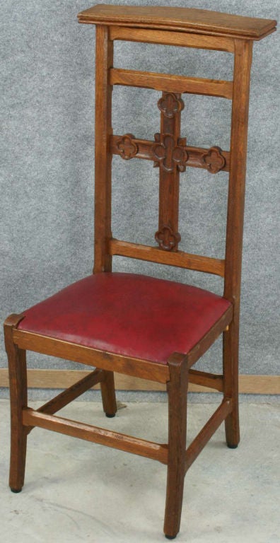 A French Country Prie Dieu Prayer Chair Kneeler in oak with Gothic style cross on back and upholstered seat