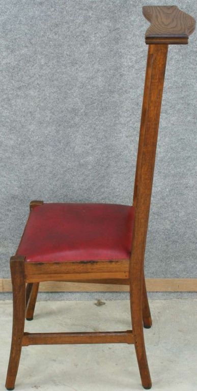 A French Country Prie Dieu Prayer Chair Kneeler in oak with a Gothic style carved cross on the back