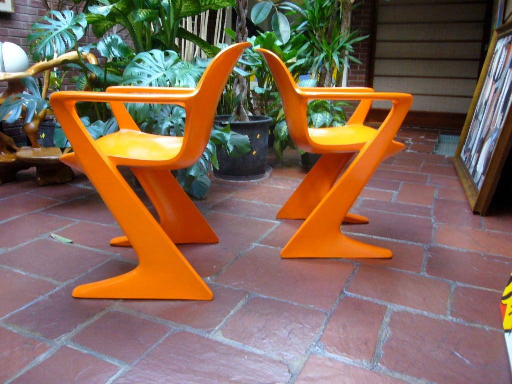 Mid-20th Century Pair of Orange 'Kangaroo' Arm Chairs by Ernst Moeckl
