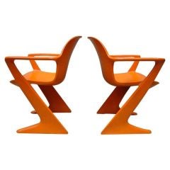 Pair of Orange 'Kangaroo' Arm Chairs by Ernst Moeckl