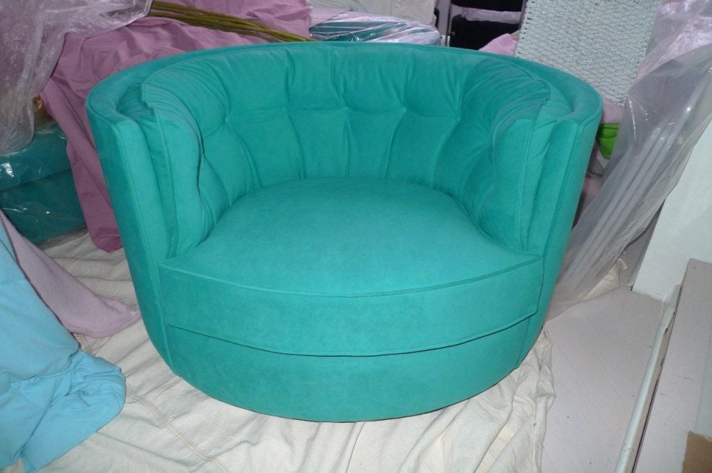 Horseshoe shaped rolling swivel tufted tub  or barrel back chairs  freshly covered in turquoise ultra-suede. Sold in pairs or as a complete set.  Perfect for a home theater. $2800 per pair. Total of 4 chairs available as of now.<br />
<br