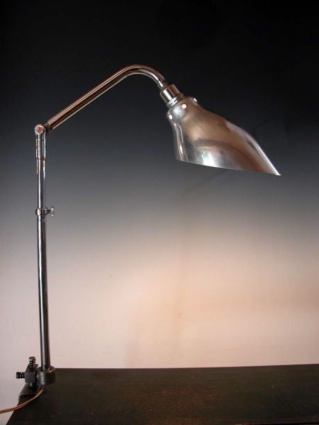 Pair of French 1950's aluminum and chromed steel Telescopic Lamps which clamp to a table or desk top.Very stylish form and aluminum shade recalls the shapes of Serge Mouille.  Jean Prouve had these in his design studio.  See Prouve archival