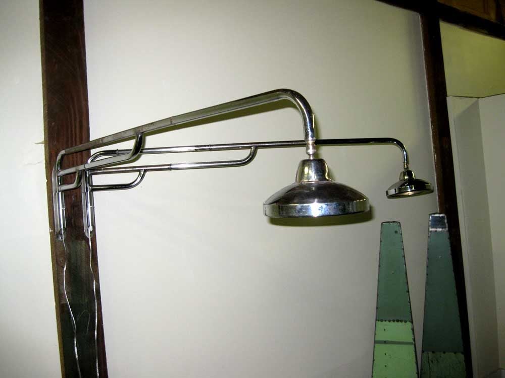 Fashioned from vintage chromed tubular steel these Prouve inspired 5 feet long industrial swing sconces will knock your socks off.