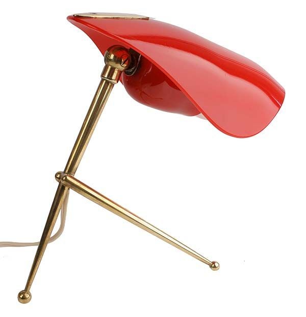Stylish 1950's European table lamp, probably Italian, with brass tripod base with ball feet and an articulating red shade made of plexiglass or a bakelite material. Terrific accent piece for a dash of color.  Looks great switched on or off. 