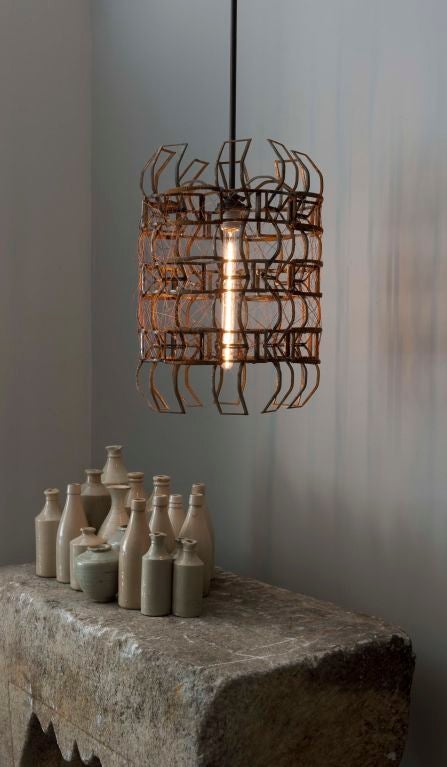 Wonderful light fixture welded from found metal. This piece can be made as a hanging pendant or a table lamp, dramatic in both setting, industrial yet delicate.
