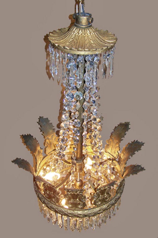 A gilt bronze and crystal basket form chandelier.