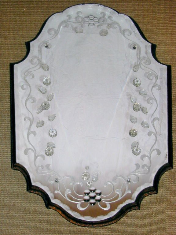 Shaped and Convoluted Oval Etched and Verre Eglomise Mirror with Applied Crystal Floral Motifs Mounted on Shaped and Ogee  Distressed Gold Wood Platform.