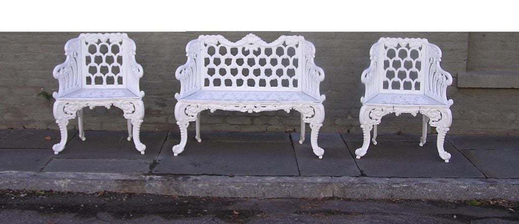 American cast iron garden bench with matching pair of chairs. Recently cleaned and powder coated for outdoor use.