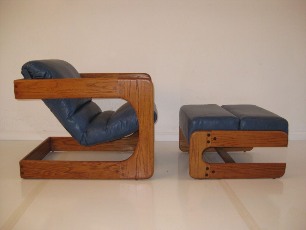 Custom solid wood sculptural chair and ottoman designed by Lou Hodges for the California Design Group of San Diego. These pieces were custom ordered from a catalog and hand made.