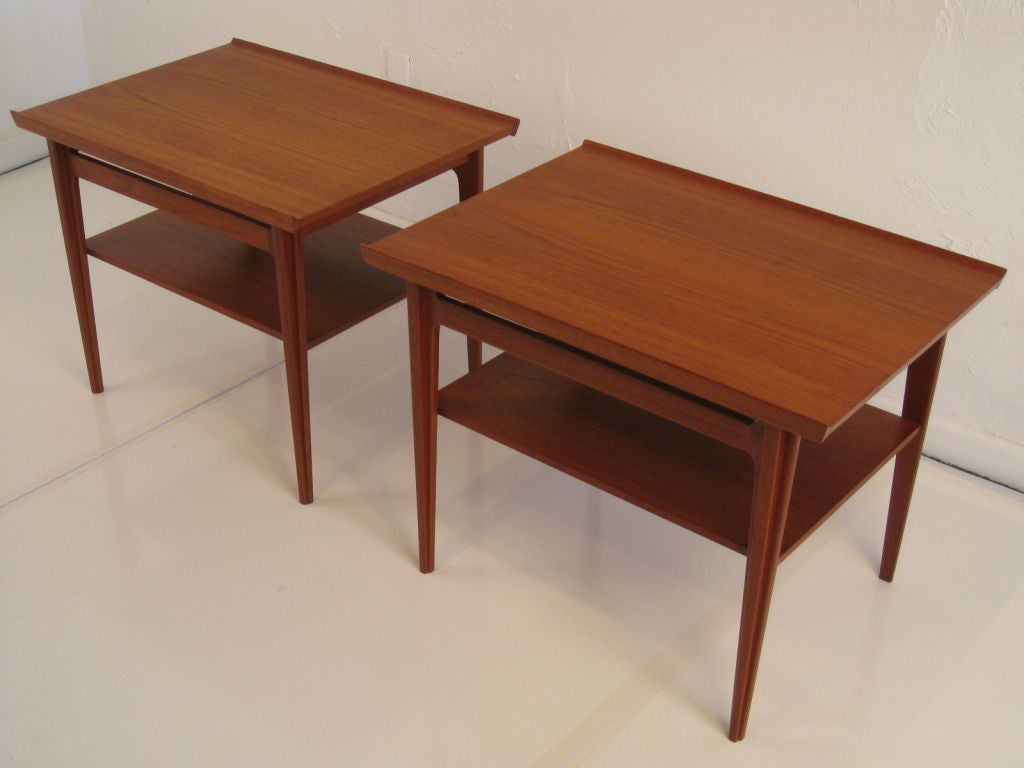 Pair of solid teak wood sculptural 500 series tables designed by Finn Juhl for France and Son's.