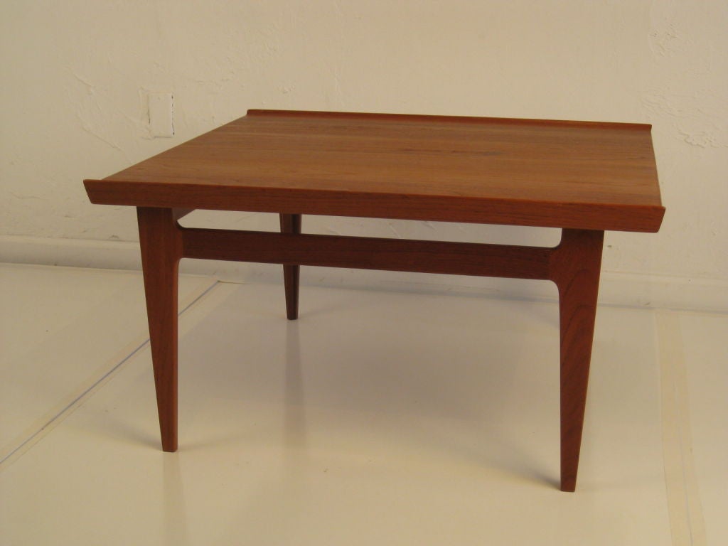 Series 500 sculptural coffee table of solid teak wood designed by Finn Juhl for France and Son's.