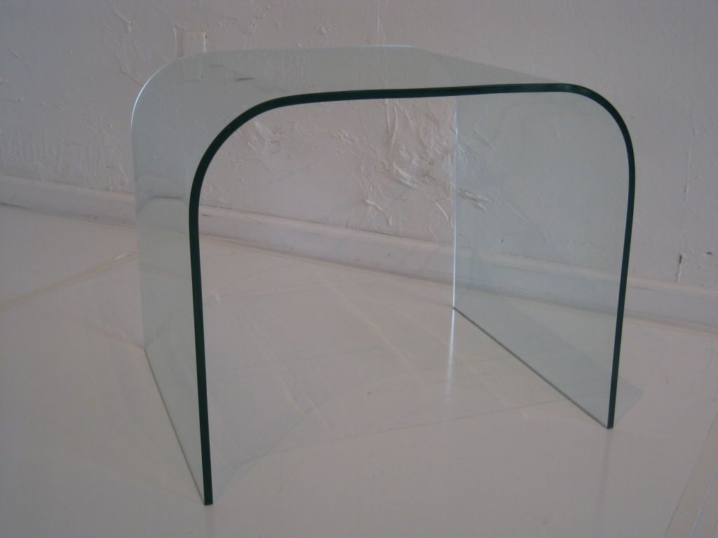 Solid bent glass table by Fiam Italia.