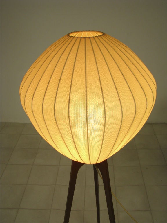 Danish teak tripod floor lamp with ribbed parchment shade, ca. 1960s.