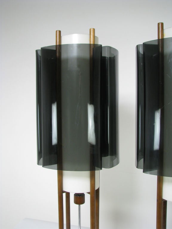 Pair of space age table lamps in walnut with smoked and frosted Lucite shades, ca. 1960s.