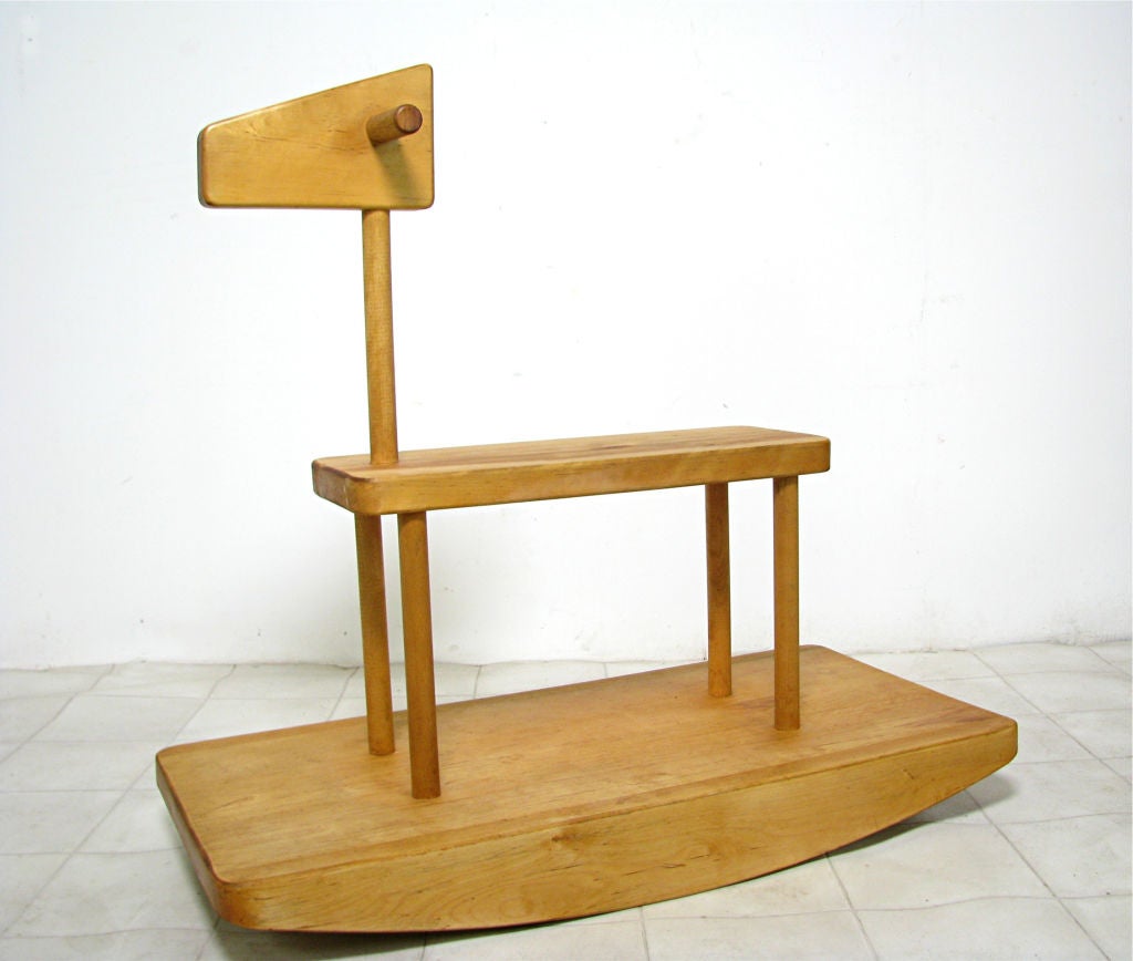 Minimalist adult-sized rocking horse hand-crafted in birch by Jack Roper and Robert Kierstead for their noted toy company Hancock Associates, in Hancock, N.H.   This piece dated 1976.   This sturdily built rocker serves as a playful sculptural