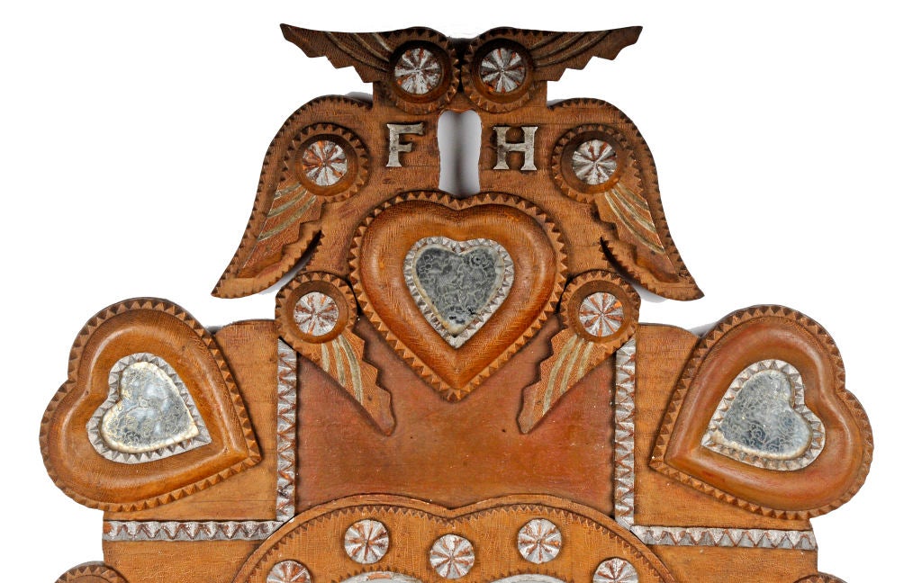 Exceptional painted tramp art 'kissing doves' wall pocket encrusted with heart shaped mirrors.  A central heart shaped mirror over two drawers with painted handles & a small compartment.  Beautifully & artistically made this early example typifies