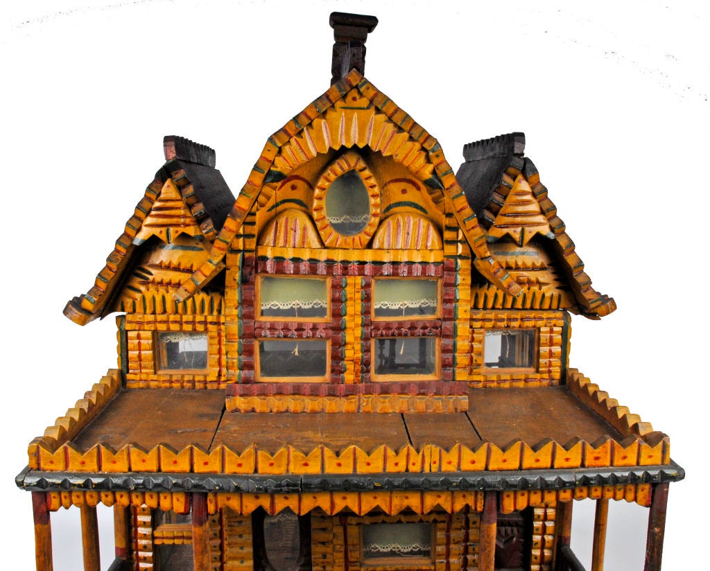 A charming painted tramp art doll house with extraordinary artistic expression. Found in the Allentown, PA area & it is made out of 'Dupont Dynamite' crate wood.  The crate wood was probably scavenged from a mining site.  Fancy wallpaper decorate