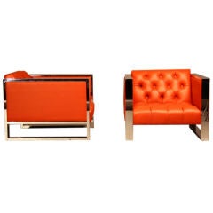 Heavy pair of chrome tufted red leather chairs by Milo Baughman