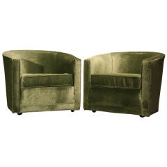 Pair of green mohair Dunbar tub chairs with rolling feet