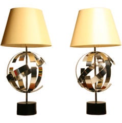 Pair of highly polished aluminum Laurel lamps with silk shades