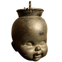 Vintage Solid blackened steel baby head
