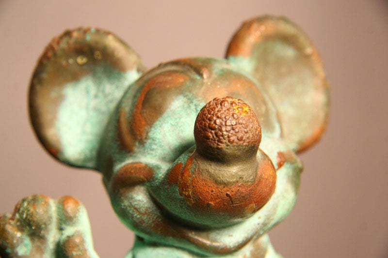 This little guy is awesome. It is solid copper and has turned green with age. It's also got some bubbling on the head which I can't even guess why is there. It is a toy mold that was used to make plastic or rubber toys.