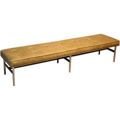 Bench in distressed tufted leather by Irwin and Estelle Laverne