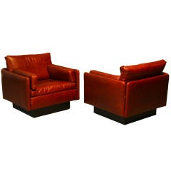 Pair of leather arm chairs by Saporiti Italia