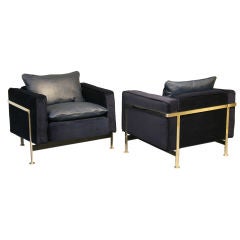 Pair of blue leather and mohair club chairs by Robert Haussmann