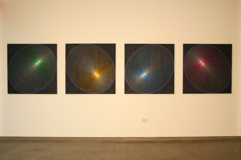 Four large paintings compose this quadriptych by Ernest Posey that is difficult to photograph because they are very kinetic and vibrate visually.  The lines as they meet the centers of the ovals are extremely precise and fine. 

New Orleans native